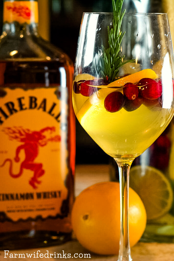 This Fireball Sangria recipe is a crisp white wine sangria with a strong cinnamon flavor. Subtle hints of orange, cranberry, and apple make this the perfect Christmas Sangria.