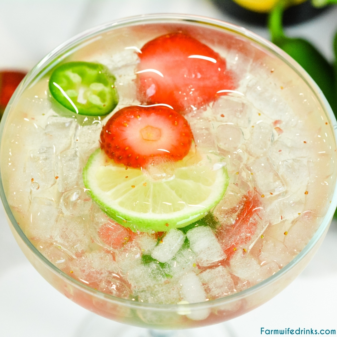 Champagne margaritas are sweet and spicy with the combination of a bottle of bubbly, sugared strawberries, Cointreau, lime juice, and jalapenos.
