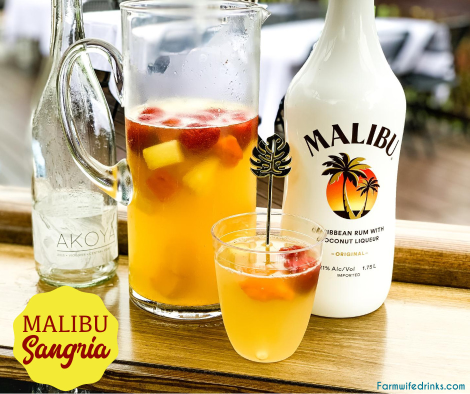 Malibu sangria recipe is a simple and perfect tropical drink for a summer day pool cocktail made with white wine, Malibu Rum, pineapple juice, and tropical frozen fruit like pineapple and mangos.