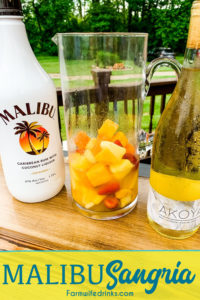 Malibu sangria recipe is a simple and perfect tropical drink for a summer day pool cocktail made with white wine, Malibu Rum, pineapple juice, and tropical frozen fruit like pineapple and mangos.