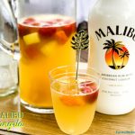 Malibu sangria recipe is a simple and perfect tropical drink for a summer day pool cocktail made with white wine, Malibu Rum, pineapple juice, and tropical frozen fruit like pineapple and mangos.