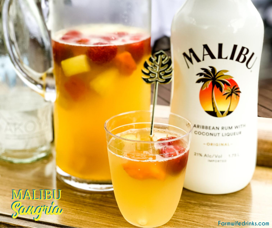 Malibu sangria recipe is a simple and perfect tropical drink for a summer day pool cocktail made with white wine, Malibu Rum, pineapple juice, and tropical frozen fruit like pineapple and mangos.