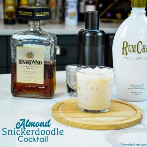 Almond snickerdoodle cocktail is the smooth almond and cinnamon after dinner drink that is made by shaking Rumchata and amaretto together and then serving over ice.