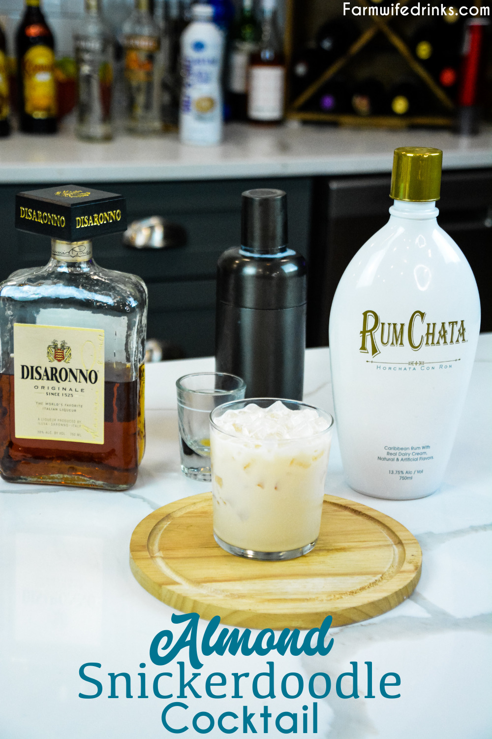 Almond snickerdoodle cocktail is the smooth almond and cinnamon after dinner drink that is made by shaking Rumchata and amaretto together and then serving over ice.