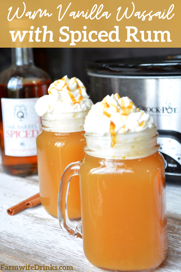 Warm vanilla wassail recipe of apple cider, pineapple juice, orange and vanilla bean for an easy crock pot wassail that pairs with spiced rum.