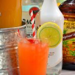 3 rum punch recipe is the sweet combination of pineapple, lime and orange juices with dark, white, and coconut rums to combine for a great party drink.