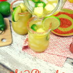 Spicy Pineapple Margaritas by the Pitcher combine the sweet nectar of pineapple infused tequila with triple sec, pineapple and lime juices and a kick of jalapeno heat.