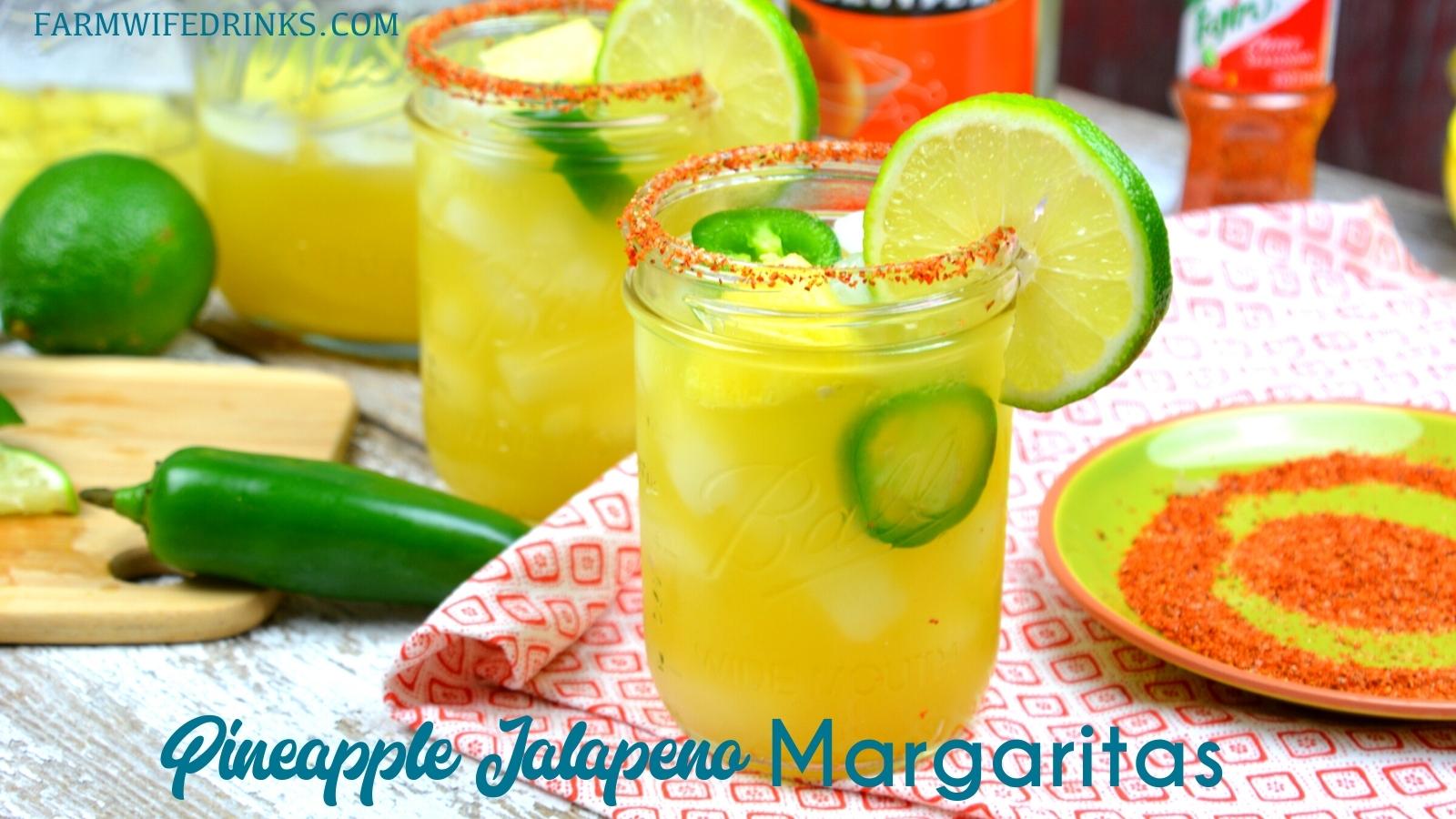 Spicy Pineapple Margaritas are an easy pineapple jalapeno margarita made with silver tequila, triple sec, pineapple and lime juices, and jalapenos with Tajin seasoning rimmed glass.