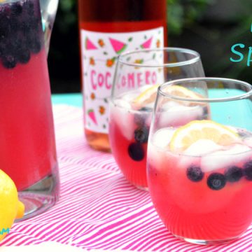 Rosé Spritzer is the sweet combination of rosé wine with tangy lemonade and ginger ale combined with blueberries and lemon slices for a refreshing summer lemonade rosé sangria.