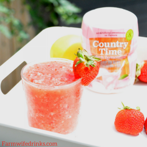 Strawberry Pink Lemonade Slushies combine frozen strawberries with pink lemonade to make a great, refreshing frozen mocktail for the kids and adults to enjoy all day long.