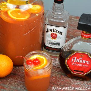 Amaretto Bourbon Punch recipe is maraschino cherries combined with limeade and orange juice with a whole lot of bourbon and just enough Amaretto. #Bourbon #Whiskey #Amaretto #Cocktails