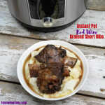 Instant Pot Red Wine Braised Short Ribs create a tender, juicy beef short rib recipe in under two hours. The beef falls off the bone after 90 minutes of pressured cooking in a bottle of red wine. #InstantPot #ShortRibs #Beef #Wine #RedWine #BeefRecipes