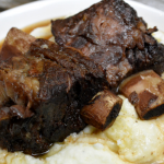 Instant Pot Red Wine Braised Short Ribs create a tender, juicy beef short rib recipe in under two hours. The beef falls off the bone after 90 minutes of pressured cooking in a bottle of red wine. #InstantPot #ShortRibs #Beef #Wine #RedWine #BeefRecipes