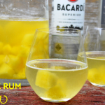 Pineapple Rum Sangria is a crisp white wine sangria combining a dry white wine, rum, frozen pineapple, and sparkling water to make a pitcher of Pineapple Sangria. #Sangria #Rum #Pineapple #Cocktails