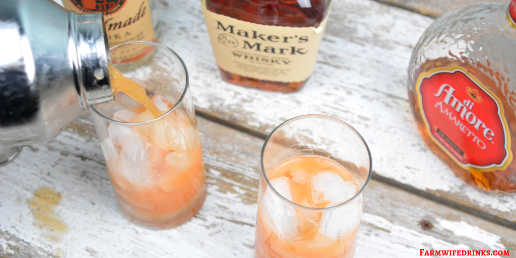 Tie me to the bedpost cocktail combines whiskey, vodka, and amaretto and then is topped off with orange juice and grenadine. #Whiskey #Amaretto #Vodka #Cocktail
