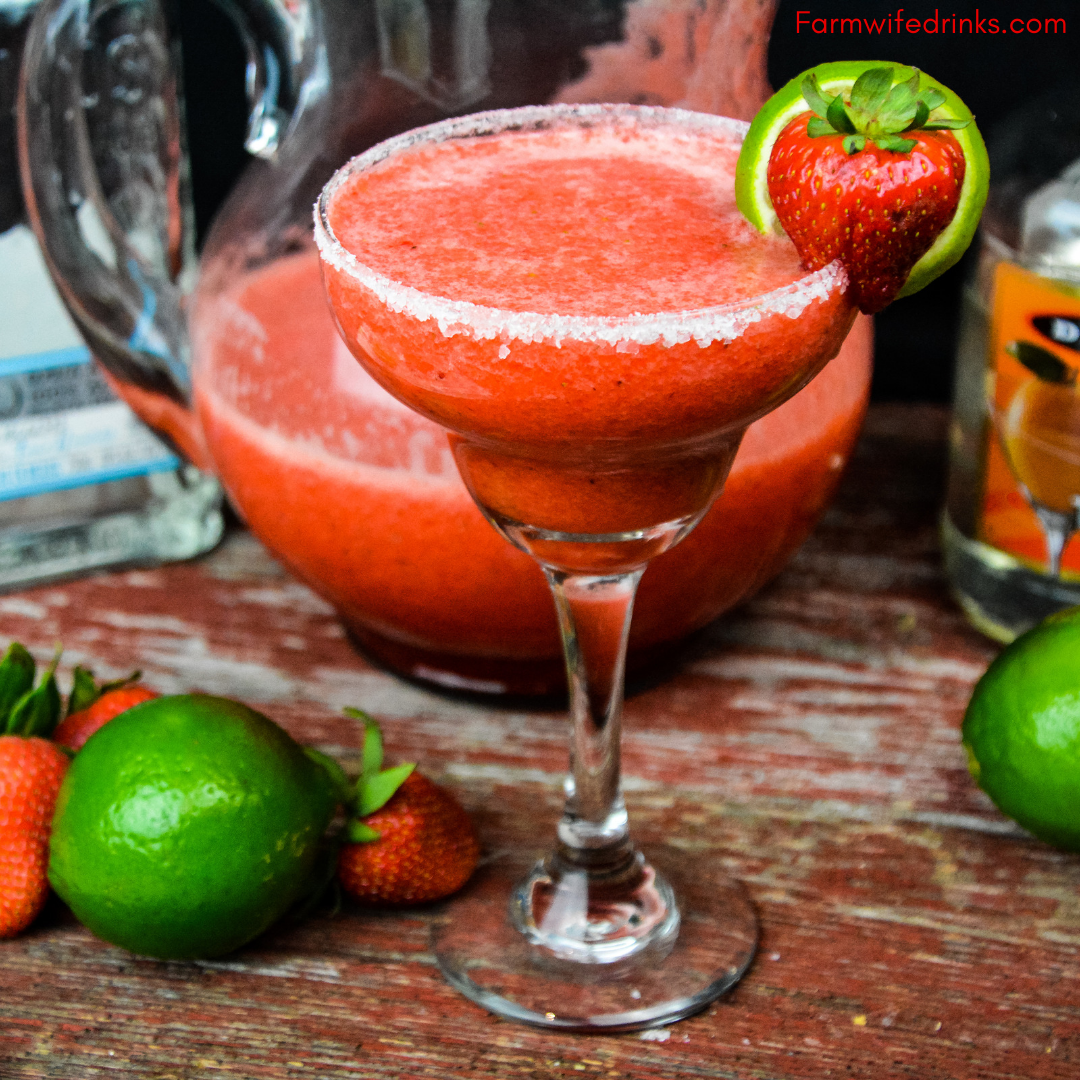 Strawberry Limeade Margaritas combine frozen limeade with fresh strawberries along with tequila and triple sec to make a whole pitcher of margaritas to enjoy. #margaritas #Strawberries #Cocktails