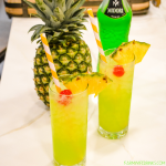 Green Hawaiian Cocktail combines all the tropical flavors of pineapple, melon, coconut, and citrus with Midori, Malibu Rum, pineapple juice, and lemon-lime soda for the best beach or pool cocktail.