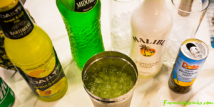 Green Hawaiian Cocktail combines all the tropical flavors of pineapple, melon, coconut, and citrus with Midori, Malibu Rum, pineapple juice, and lemon-lime soda for the best beach or pool cocktail.