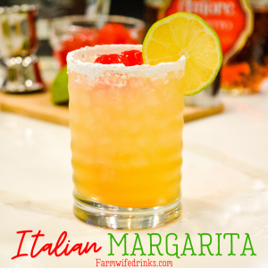 This Italian Margarita is a simple cocktail recipe made with tequila, amaretto, triple sec, and sour mix, poured into a powdered sugar rimmed glass.