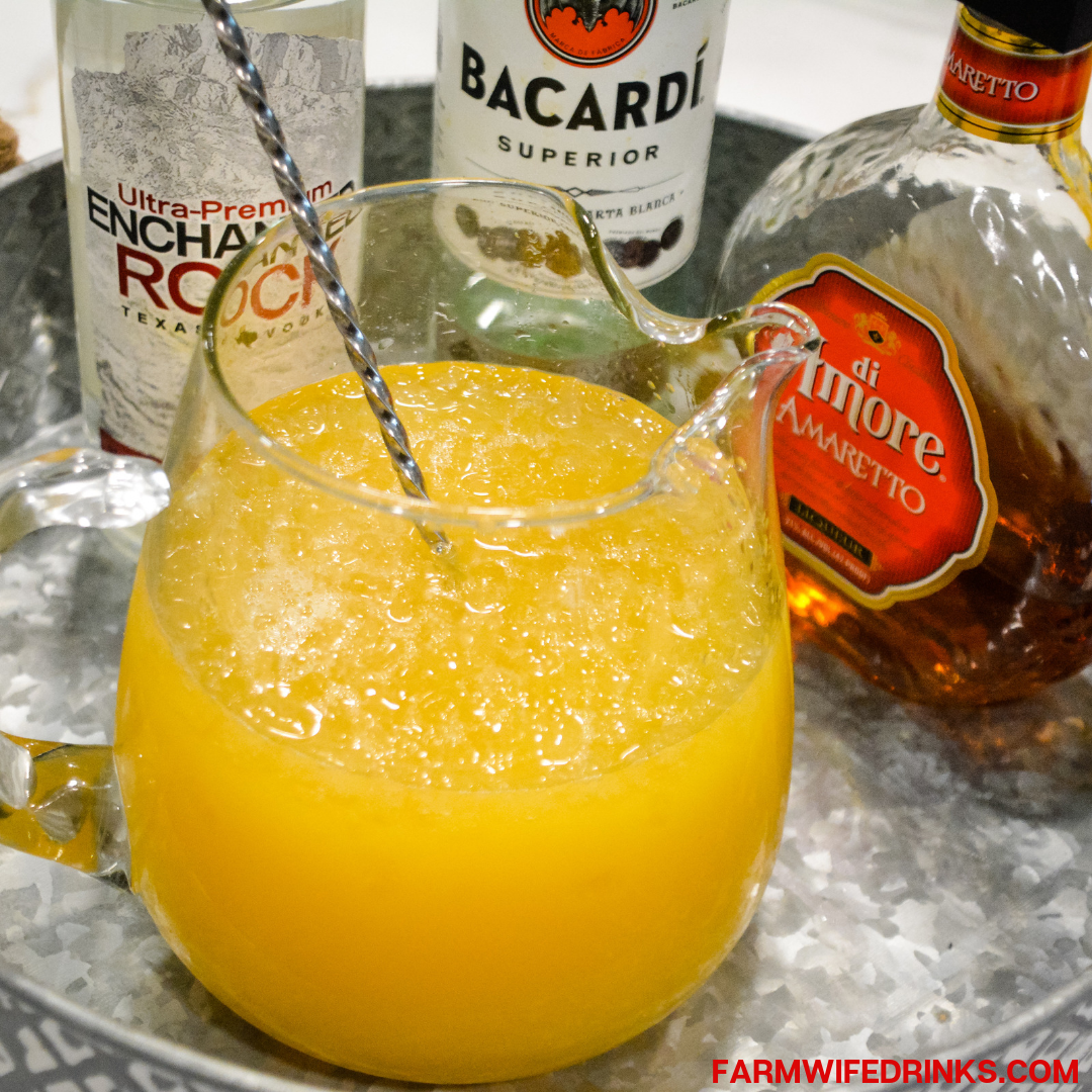 Yellow Hammer Slammer drink is strong cocktail perfect for tailgate parties and can be made by the pitcher or one at a time by stirring together vodka, rum, amaretto, pineapple juice, and OJ.