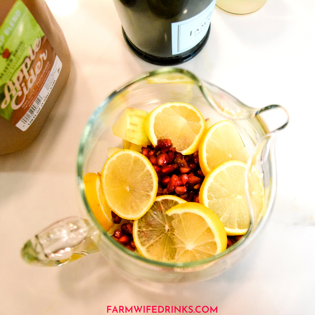 Sparkling ginger apple cider sangria is the rich flavors of apple cider, ginger liqueur, prosecco with hints of lemon and pomegranate for a satisfying fall sangria recipe.