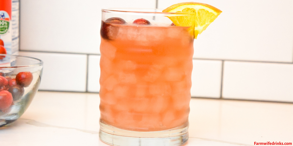 Orange cranberry vodka cocktail is the combination of cranberry and orange juice along with mandarin and raspberry vodkas for a crisp refreshing Christmas Eve cocktail.