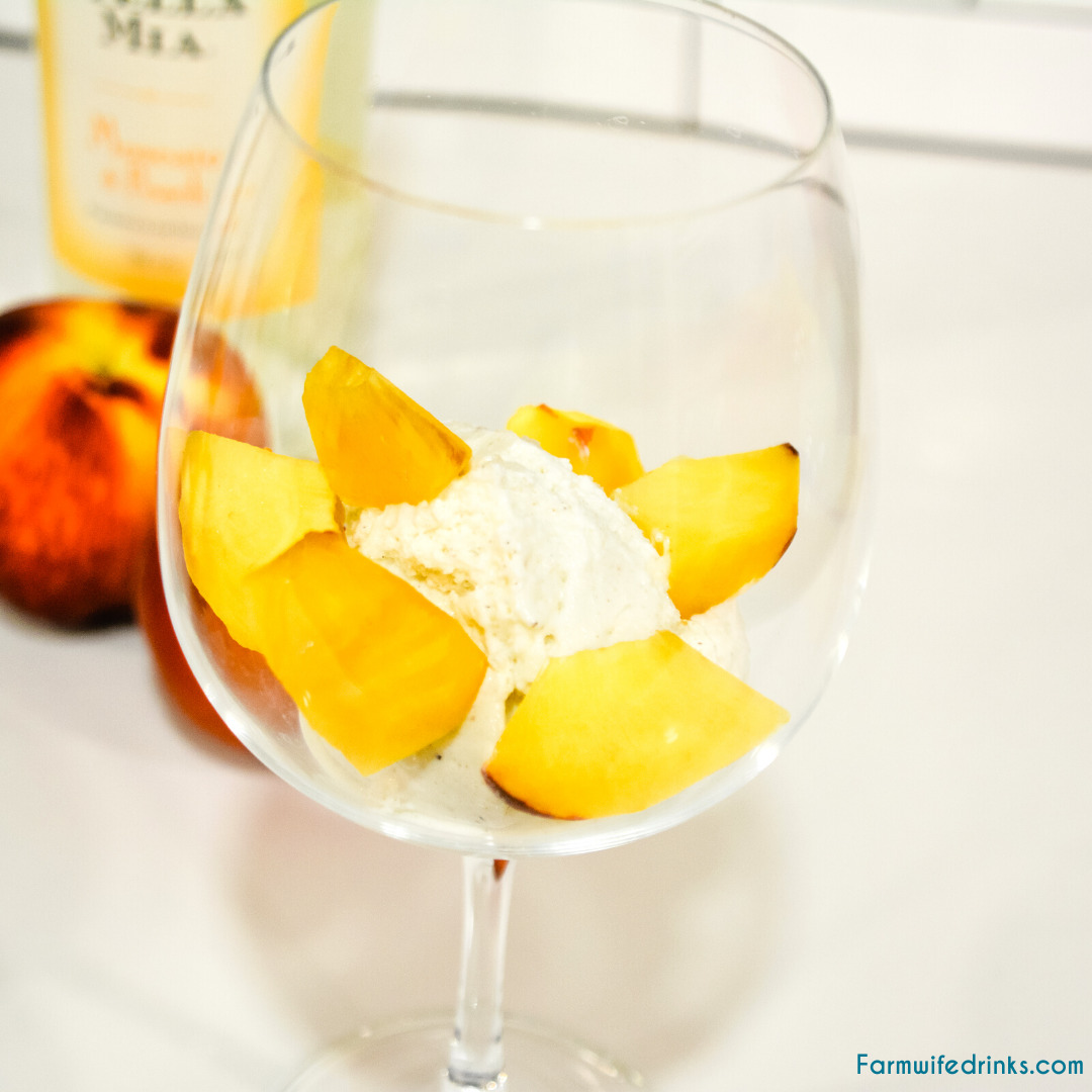 Peaches and Cream Wine Float Recipes combines a Moscato wine with vanilla bean ice cream and fresh peaches for the most decadent white wine float that can also serve for an amazing dessert drink.