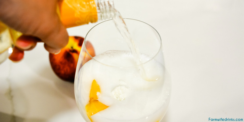 Peaches and Cream Wine Float Recipes combines a Moscato wine with vanilla bean ice cream and fresh peaches for the most decadent white wine float that can also serve for an amazing dessert drink.