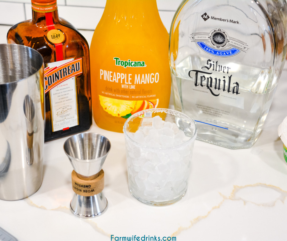 Pineapple mango margaritas are a simple three-ingredient margarita that is better than any mango margarita made with sweet and sour with the simple ingredients of pineapple mango juice, tequila, and Cointreau.