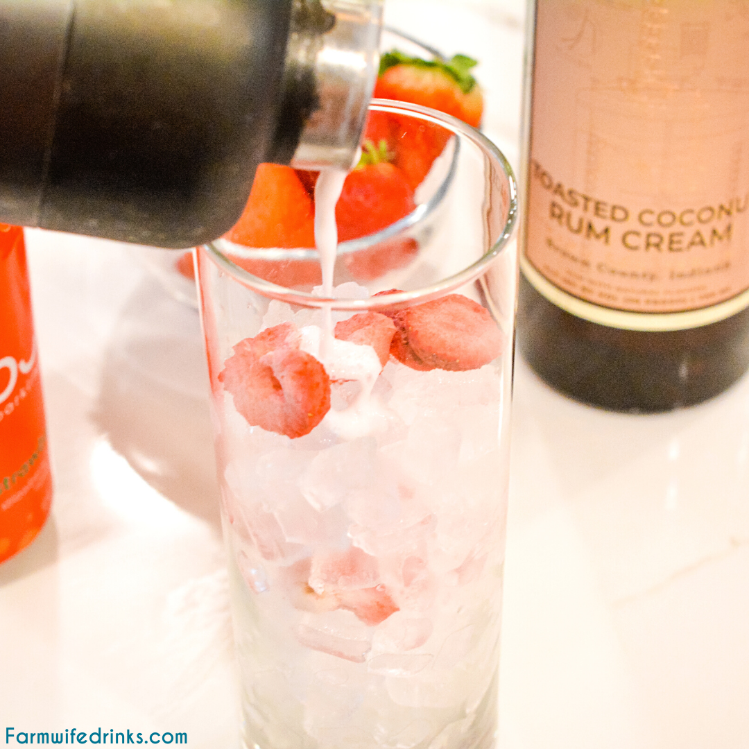 Pink drink cocktail is a yummy toasted coconut rum cream mixed with strawberries and sparkling water to make this delicious strawberry coconut cream rum cocktail.