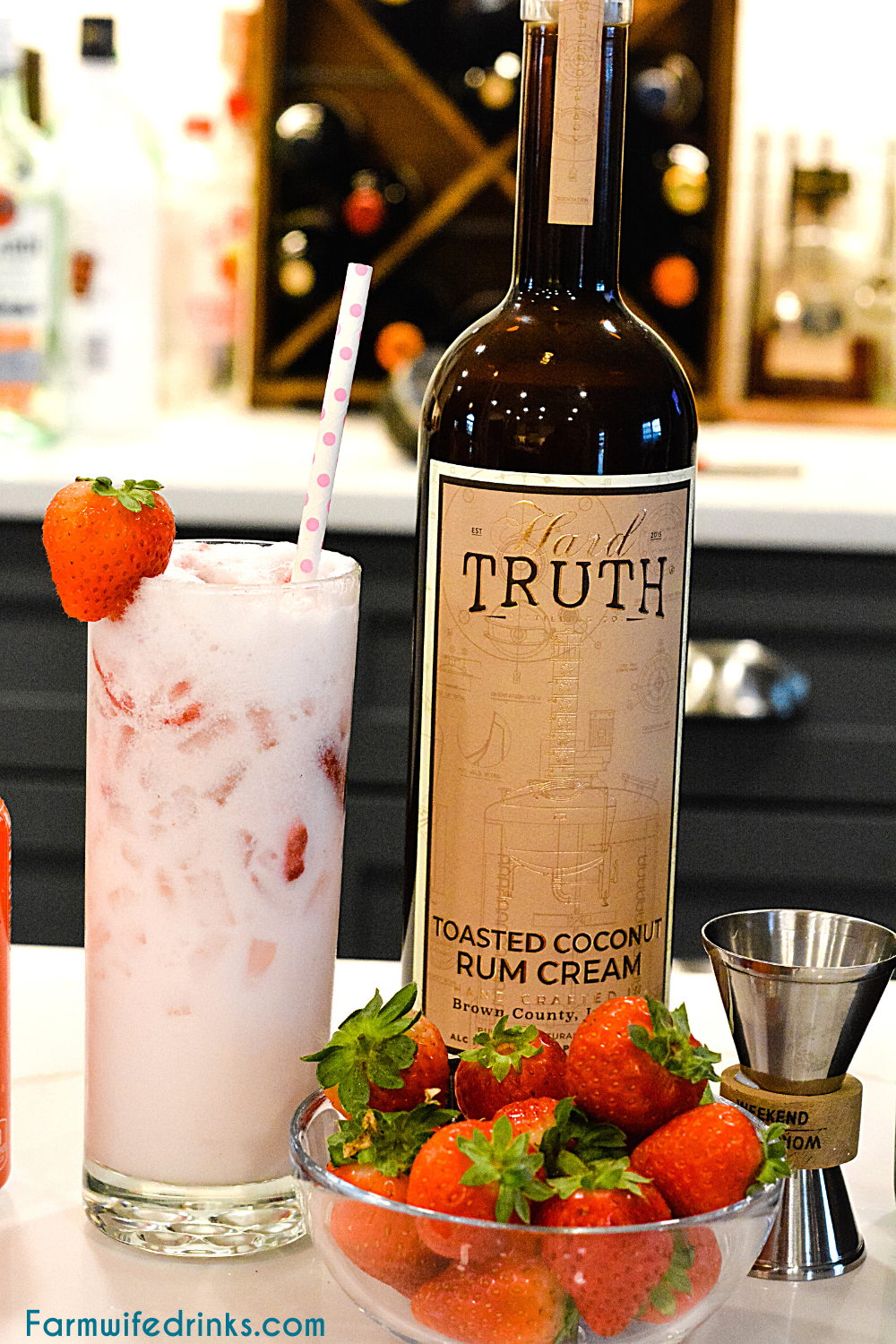 Pink drink cocktail is a yummy toasted coconut rum cream mixed with strawberries and sparkling water to make this delicious strawberry coconut cream rum cocktail.