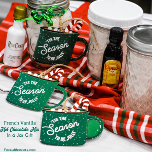 French vanilla hot chocolate mix and a bottle of Rumchata is an easy to make mason jar drink mix gift made with dried milk, Nesquik, french vanilla creamer, pudding, and powdered sugar.