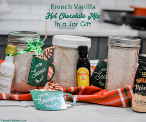 French vanilla hot chocolate mix and a bottle of Rumchata is an easy to make mason jar drink mix gift made with dried milk, Nesquik, french vanilla creamer, pudding, and powdered sugar.
