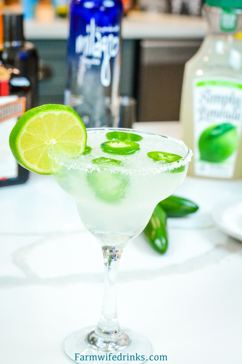 This spicy margarita does just that by combining a limeade, tequila, Cointreau with a bit of jalapeno for fresh jalapeno margaritas.