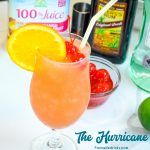 The New Orleans Hurricane Drink can be made at home with light and dark rum, passion fruit juice, orange juice, and grenadine. Top it off with a simple orange slice and maraschino cherries.