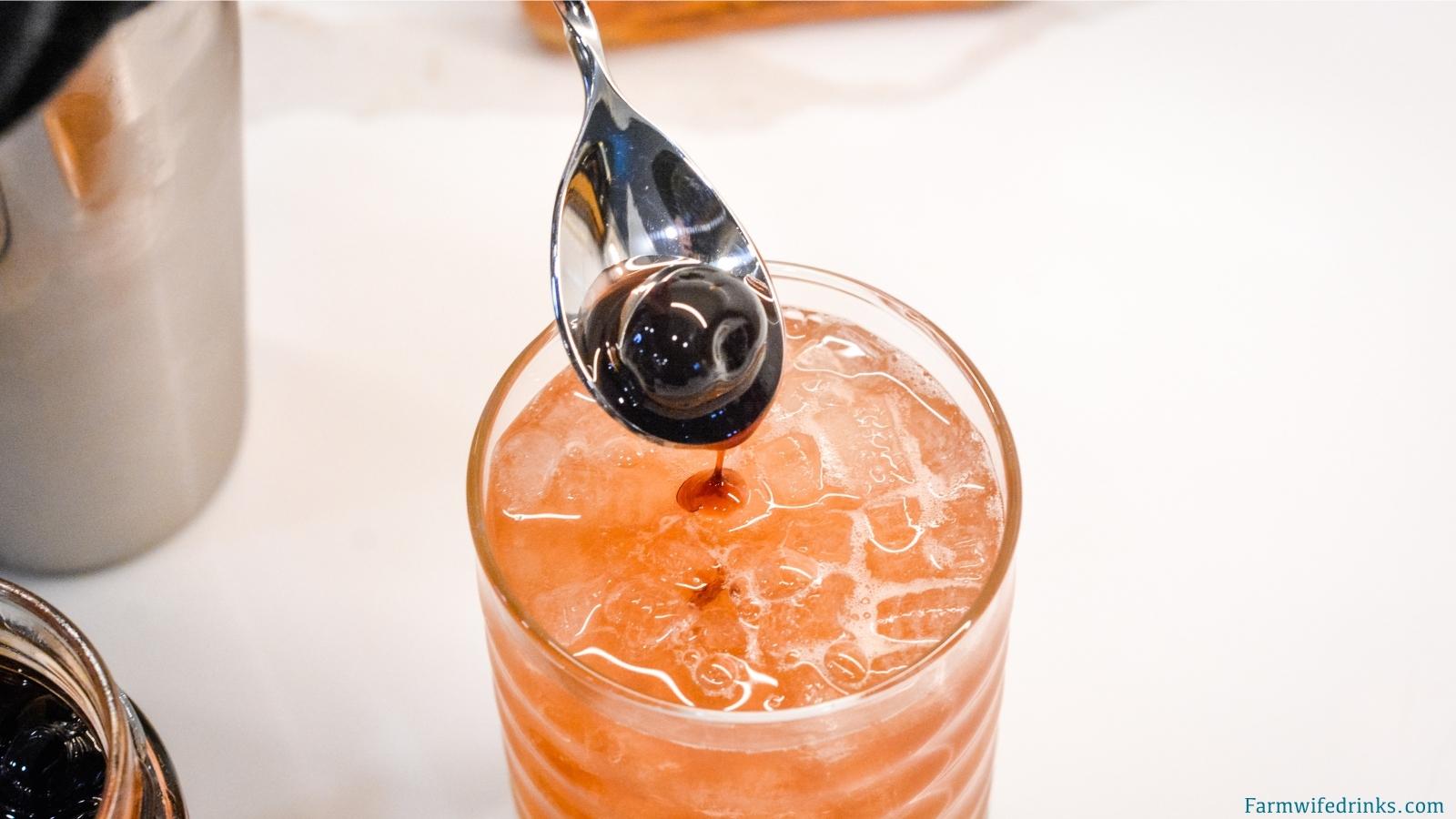 This fruity cocktail is a cherry amaretto limeade cocktail made easily with the combination of amaretto, limeade, and maraschino cherries.