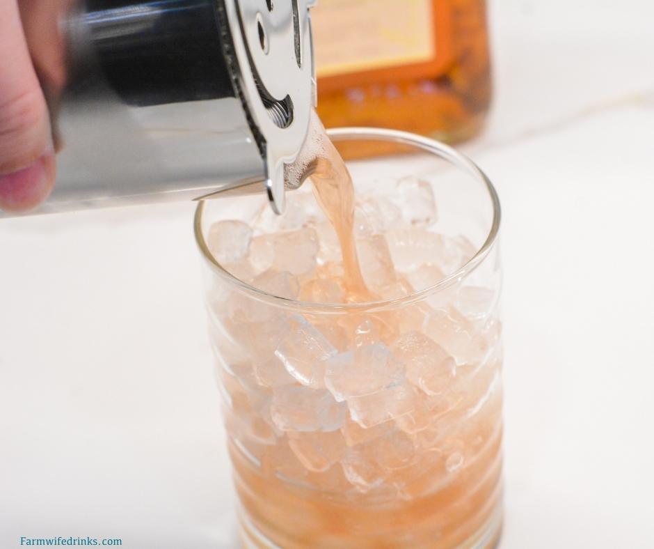 This fruity cocktail is a cherry amaretto limeade cocktail made easily with the combination of amaretto, limeade, and maraschino cherries.