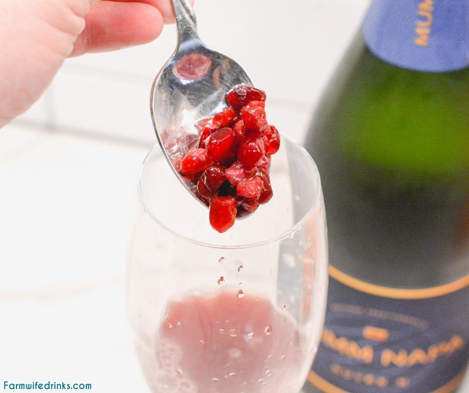 This orange pomegranate champagne spritzer is just that easy fancy champagne cocktail you need to know how to make for celebrations.