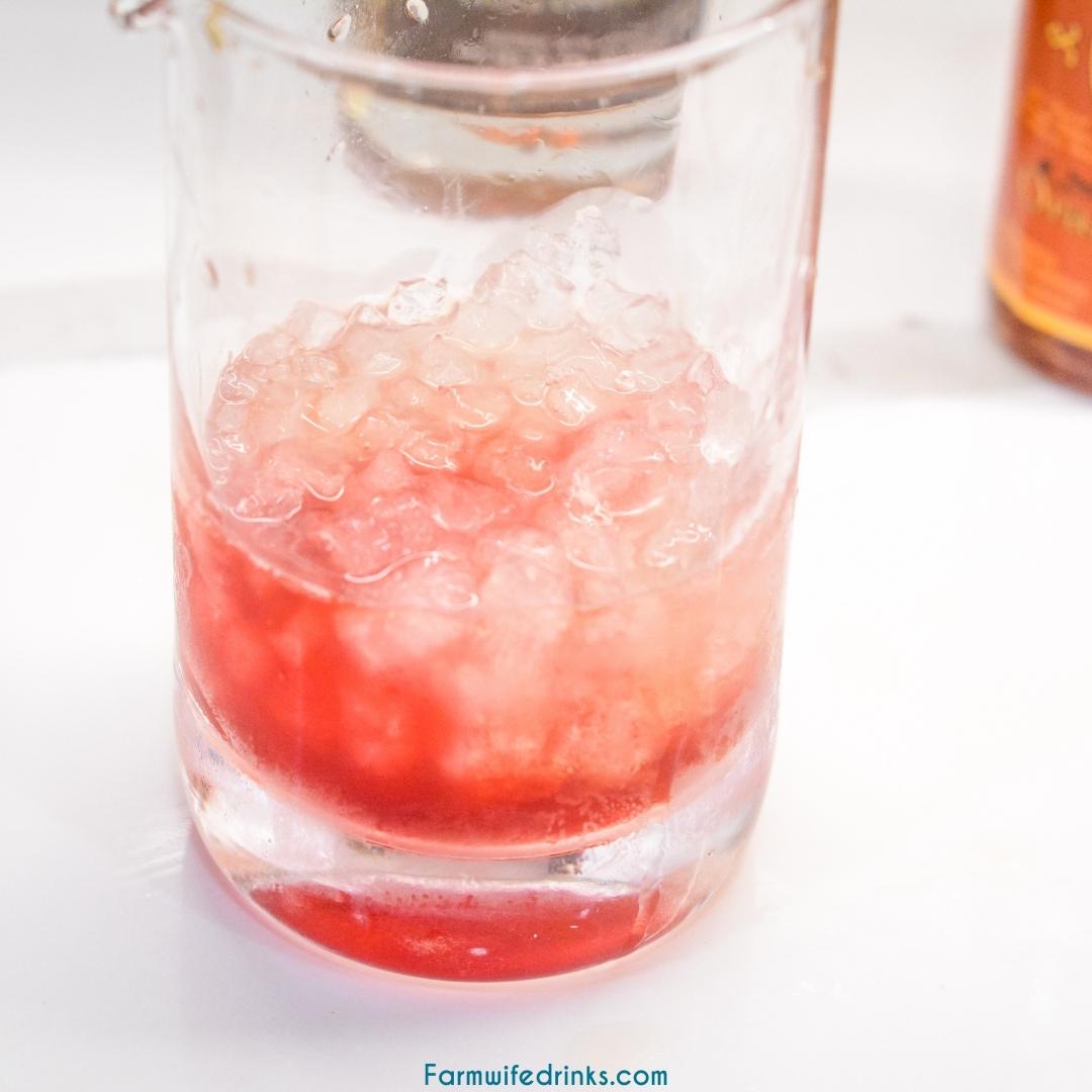 Peanut Butter Whiskey and Jelly cocktail is the liquid version of everyone's favorite sandwich that combines orange bitters, pomegranate juice, and sparkling water with the peanut butter whiskey.