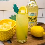 Pineapple Lemonade Vodka Cocktail is a sweet spiked punch made with pineapple juice, lemonade concentrate, lemon vodka, and sparkling water.