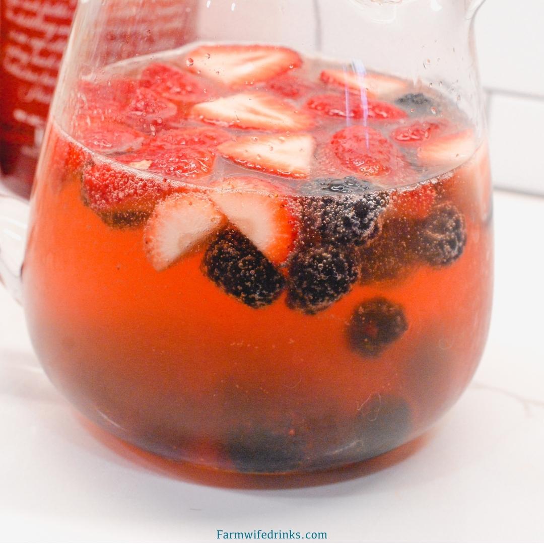A refreshingly light and fruity champagne punch with vodka is easy to put together with real fruit, juices, vodka, and of course champagne.