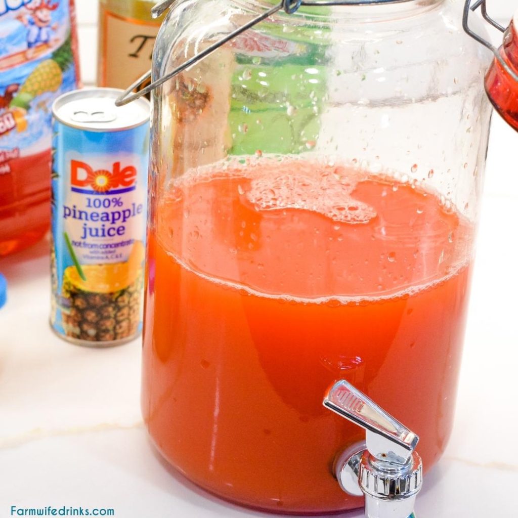 Vodka party punch is a mixture of Hawaiian Punch, orange juice, pineapple juice, ginger ale, and vodka.