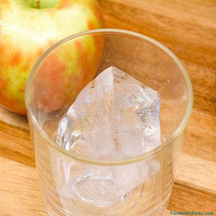 Large Ice Cube in a rocks glass for apple cider cocktail