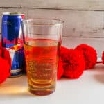Shot Glass of Vodka inside Taller Glass filled with Red Bull
