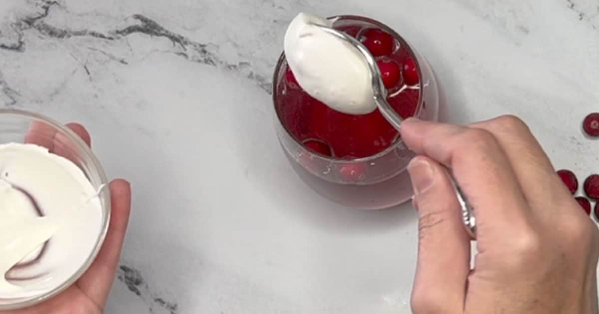 Add ¼ cup of Whipped cream to top of glass.