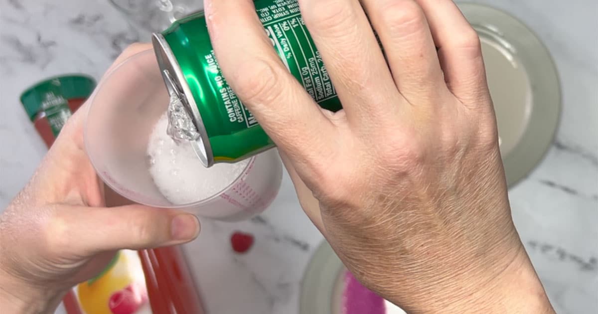 Measuring out the 7up for Raspberry 7up Punch.