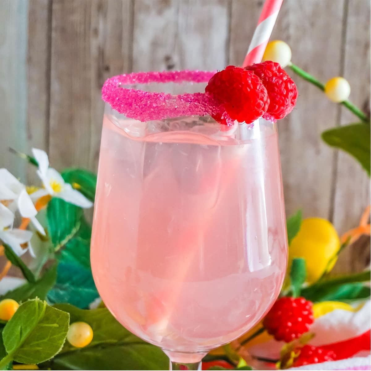 Raspberry 7up Punch, sugar rimmed and pink striped straw.
