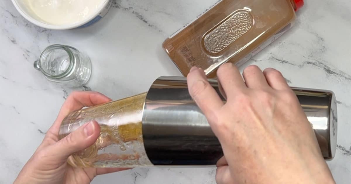 Caramel Apple Margarita ingredients being shaken in Cocktail shaker.