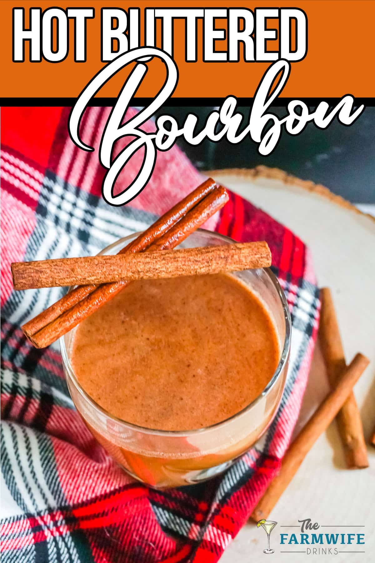 Cinnamon sticks layered on top of Hot Buttered Bourbon Cocktail.