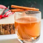 Wood tray next to piping Hot Buttered Bourbon.